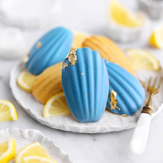 Suncore Foods Lemon Madeleines Dipped in Aqua Blue Spirulina White Chocolate
